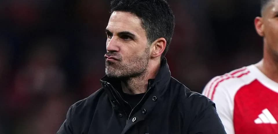 Coach gesturing on the sidelines during match