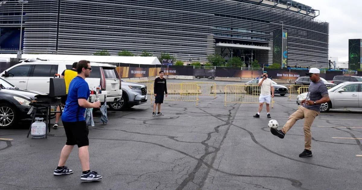 Group playing soccer in parking lot near stadium