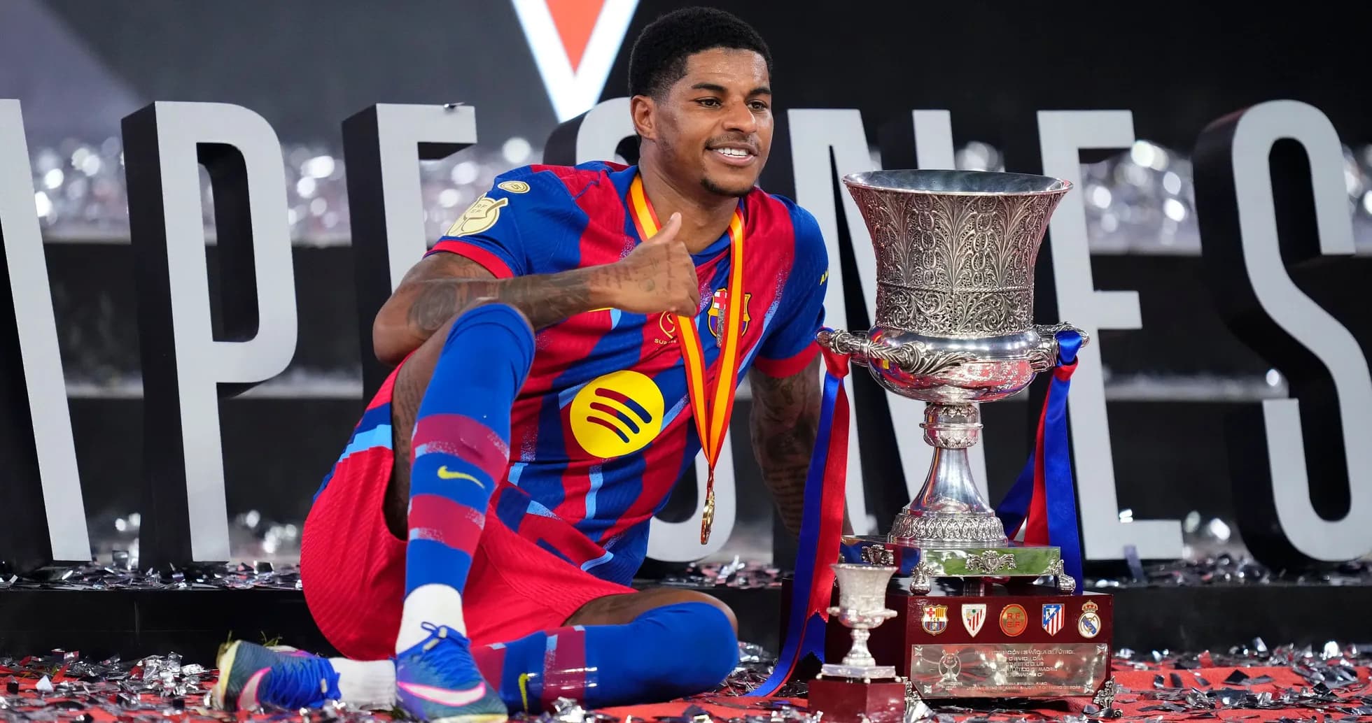 Player celebrating with trophy at victory ceremony