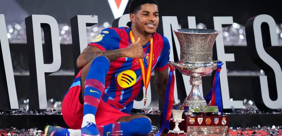 Player celebrating with trophy at victory ceremony