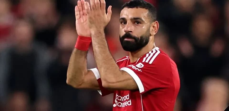 Player applauding fans after match at Anfield