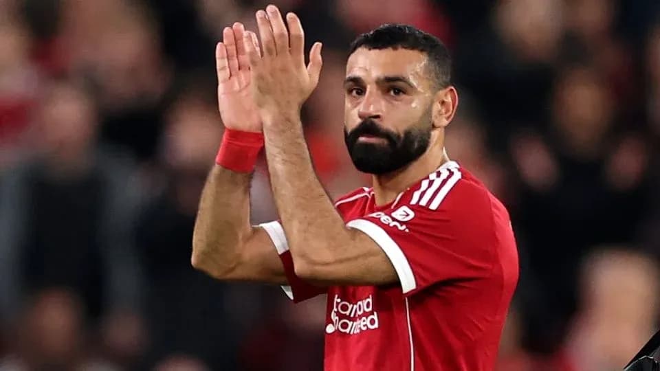 Player applauding fans after match at Anfield