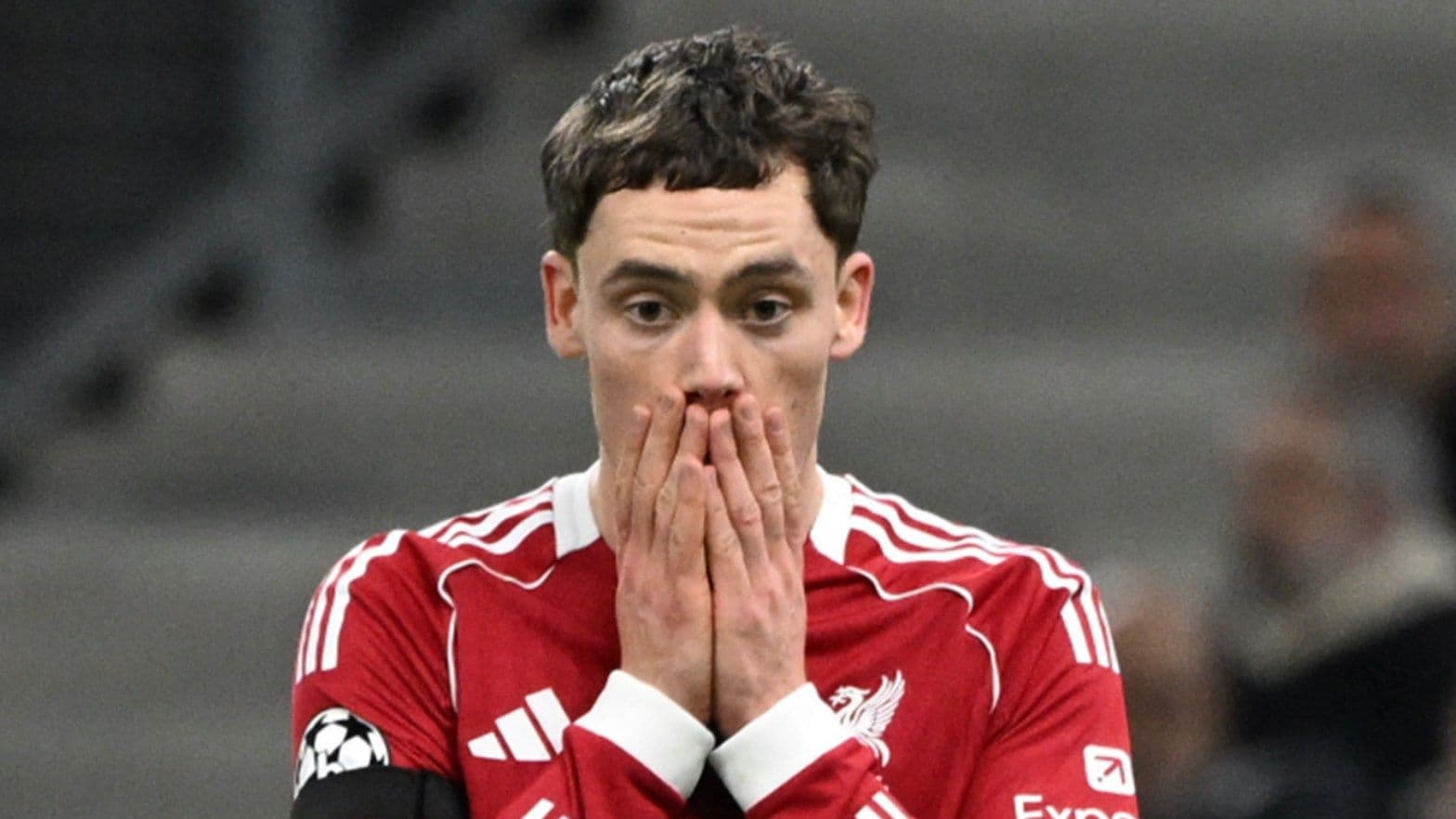 Player in Liverpool kit covering face with hands