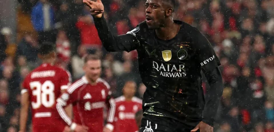 Player celebrating during a match in the rain