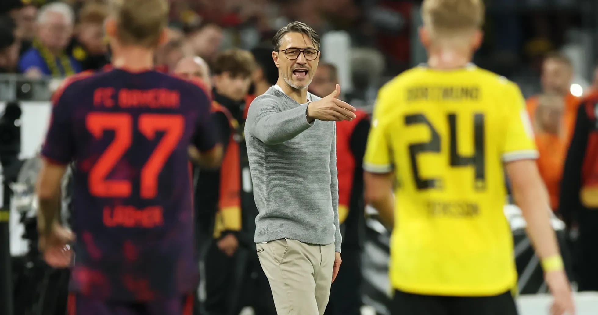 Coach giving instructions during a football match