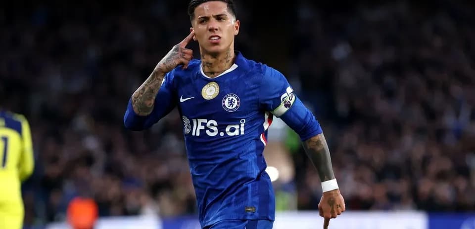 Chelsea player celebrating with hand gesture after scoring
