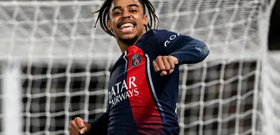 Player celebrating a goal in PSG jersey