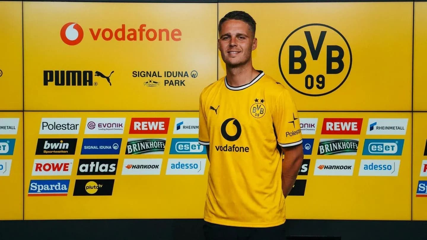 Player in Borussia Dortmund jersey at press event