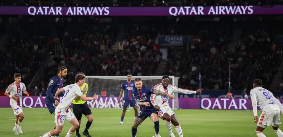 Players competing for the ball during PSG match