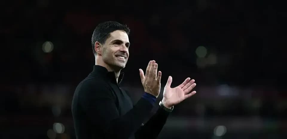 Coach applauding supporters after the match