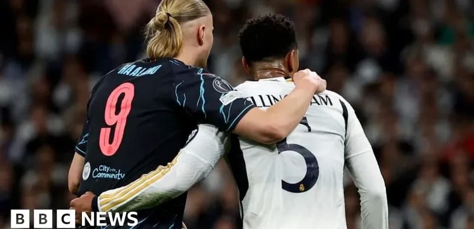 Two players embracing on the field during match