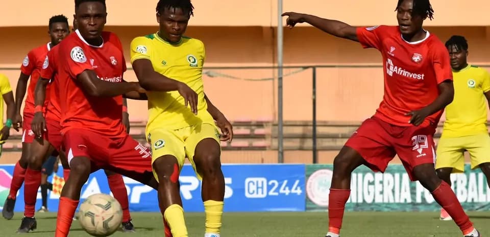 Players contesting for the ball during NPFL match