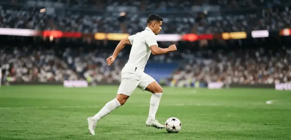 Player running with ball during a football match