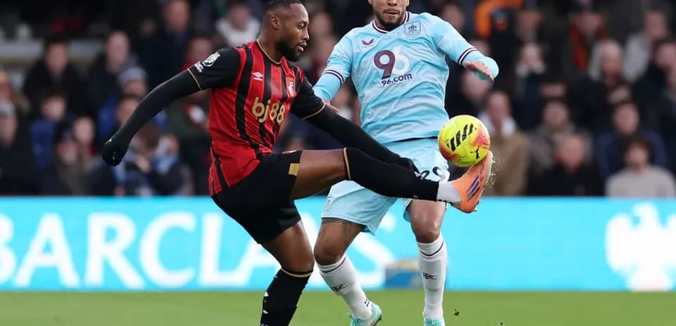 Players from both teams competing for the ball.