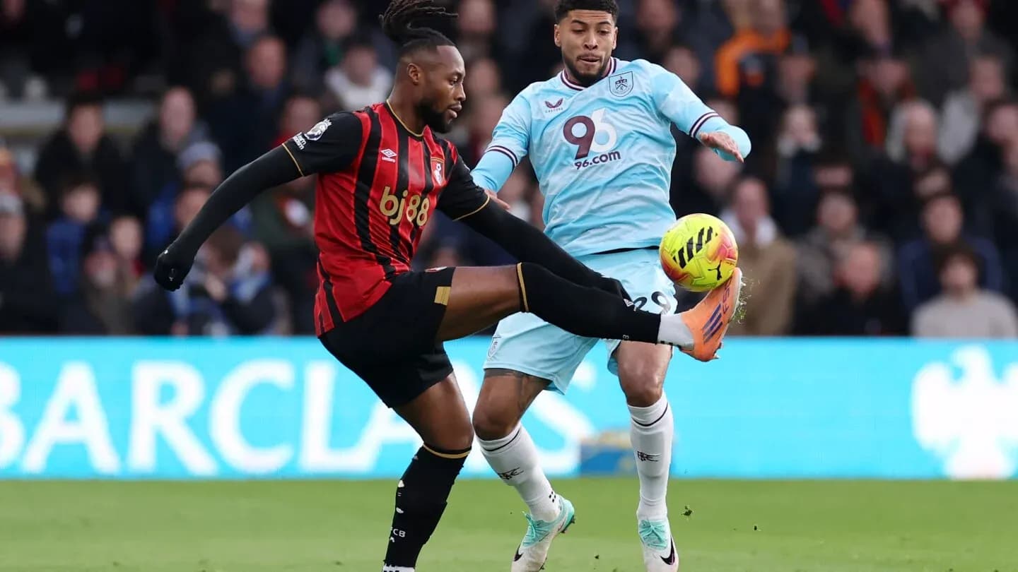 Players from both teams competing for the ball.