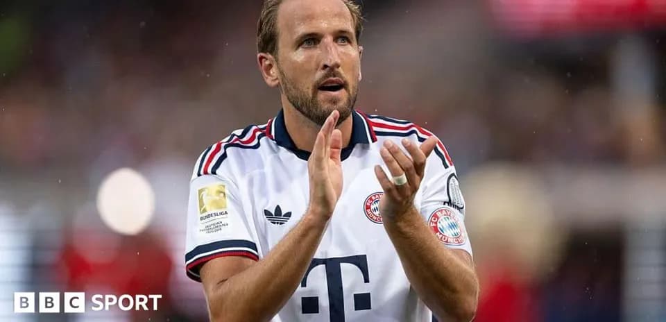 Player applauding fans wearing Bayern Munich kit