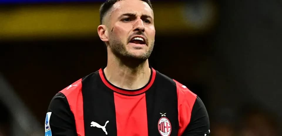 Player in AC Milan jersey during match action