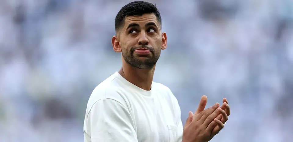 Player clapping during pre-match warm-up on field