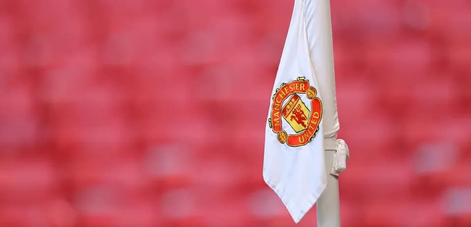 Corner flag with Manchester United logo displayed