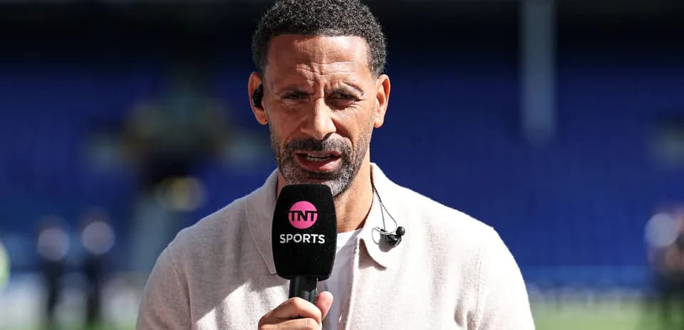 Presenter speaking into microphone on sports set
