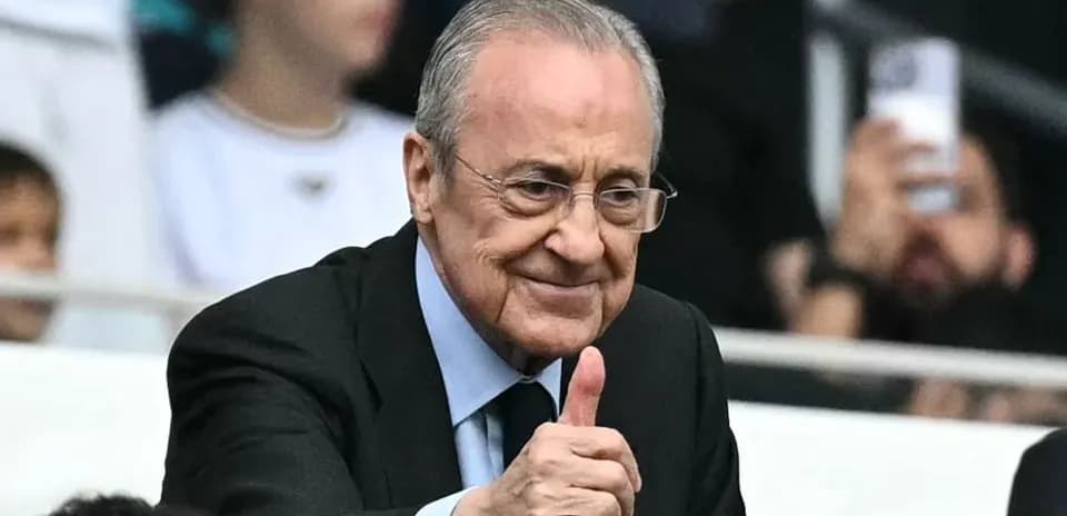 Man giving a thumbs up in stadium stands