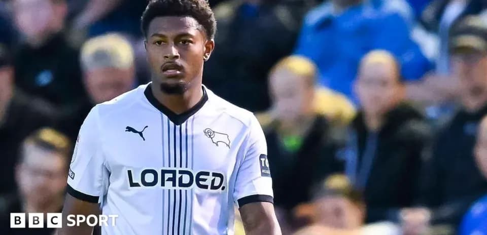 Player in Derby County kit on the pitch