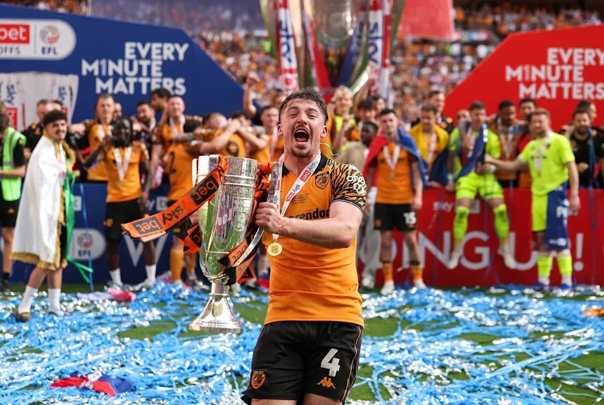 Player celebrating with trophy during victory ceremony