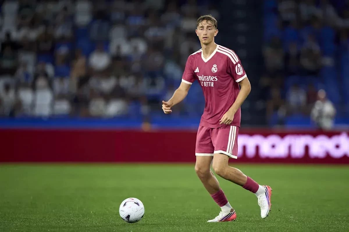 Player in pink uniform with ball on field