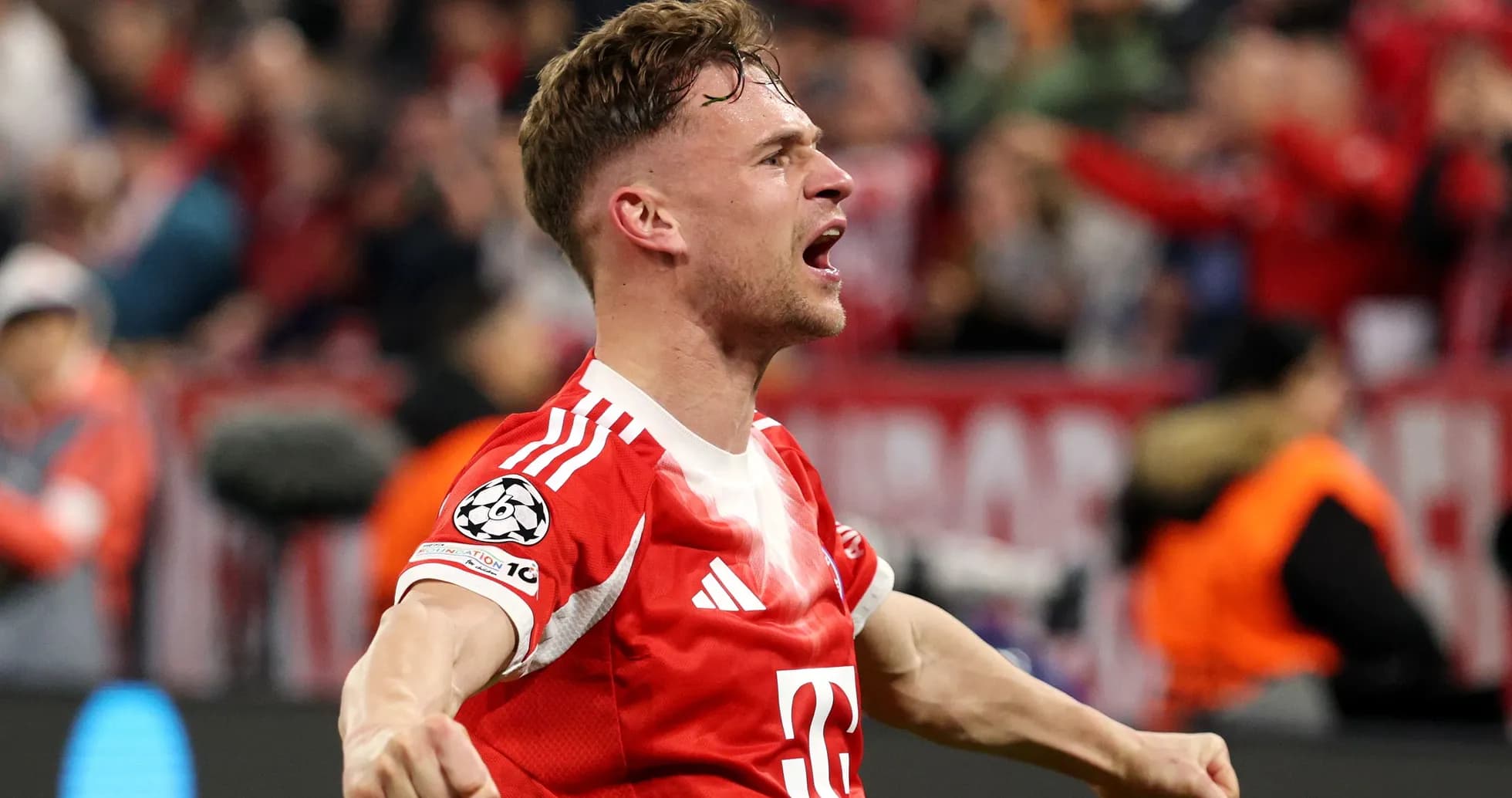 Player celebrating a goal in a red jersey