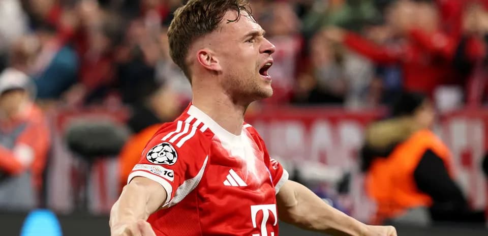 Player celebrating a goal in a red jersey