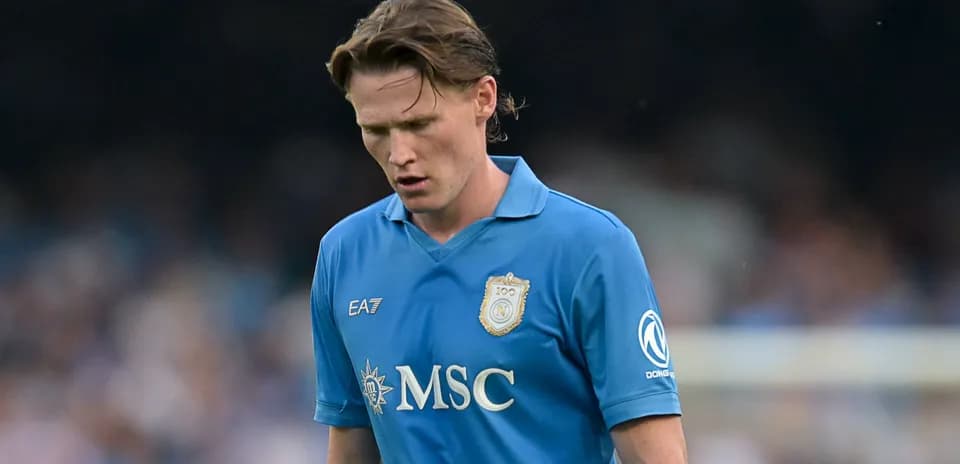 Player in blue kit walking during a match