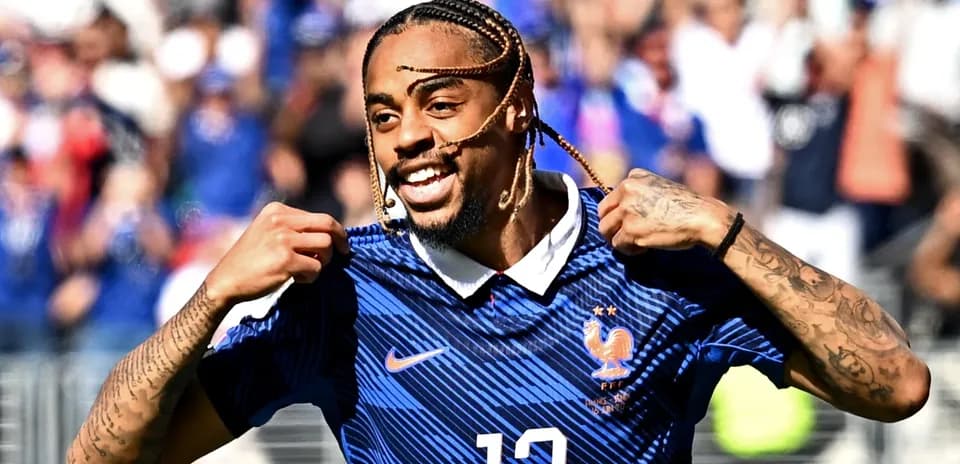 Player celebrating in France national team jersey