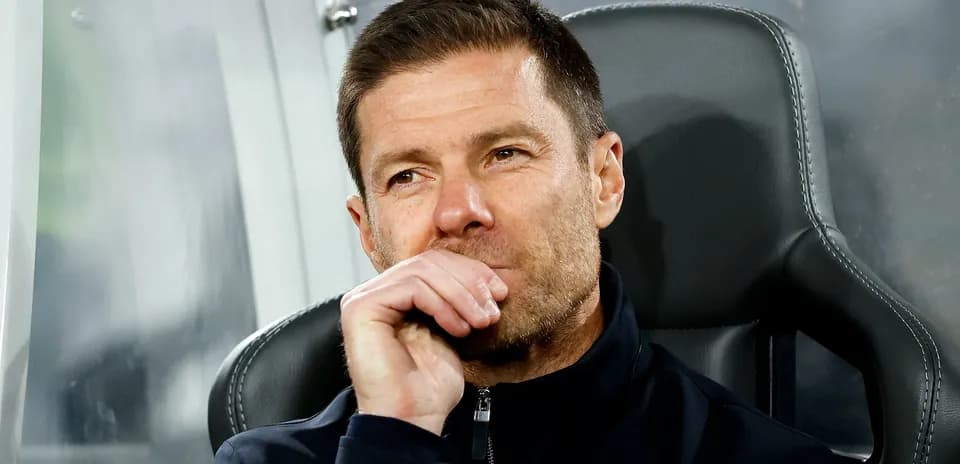 Coach sitting on bench during match observation