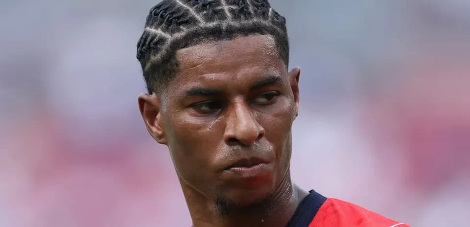 Player with braided hairstyle during match warm-up