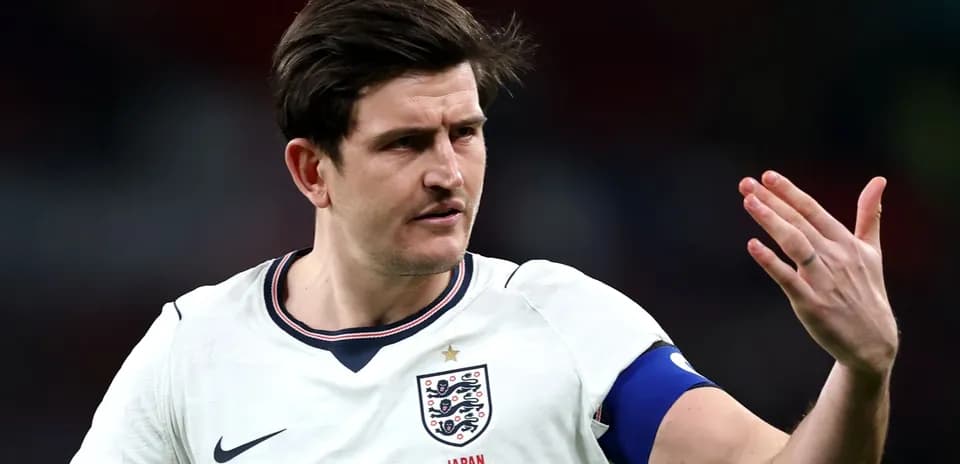 Player gesturing during a football match for England