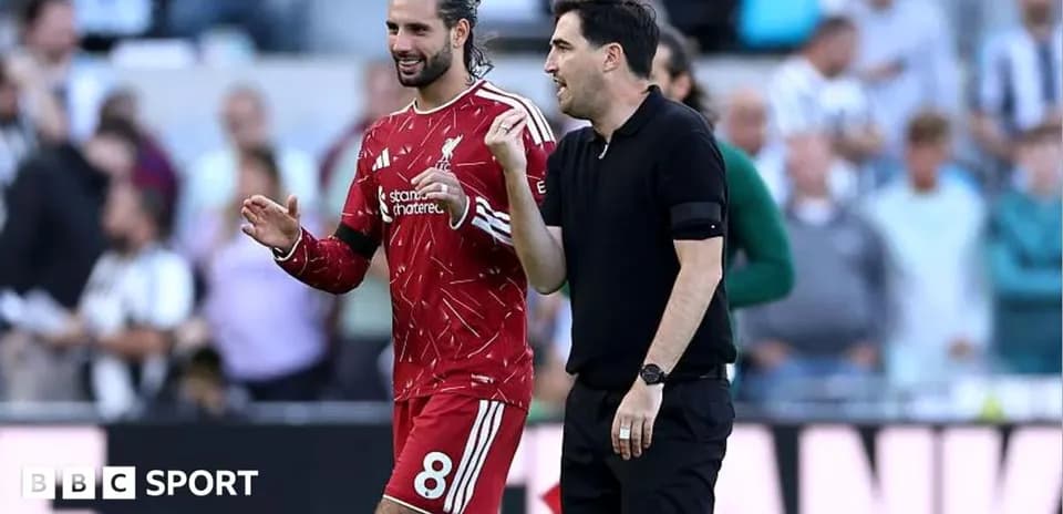 Player and coach discussing on the field