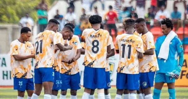 Football team huddled together before match