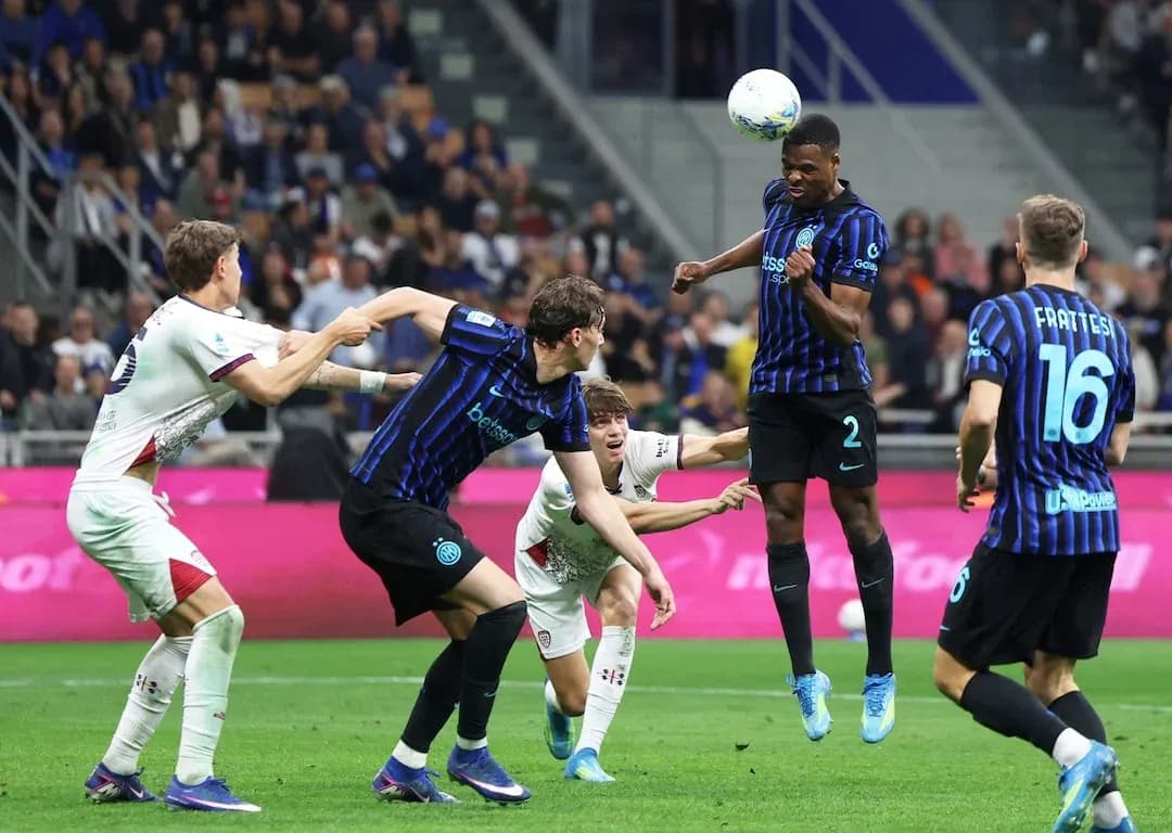 Inter player heads the ball during match