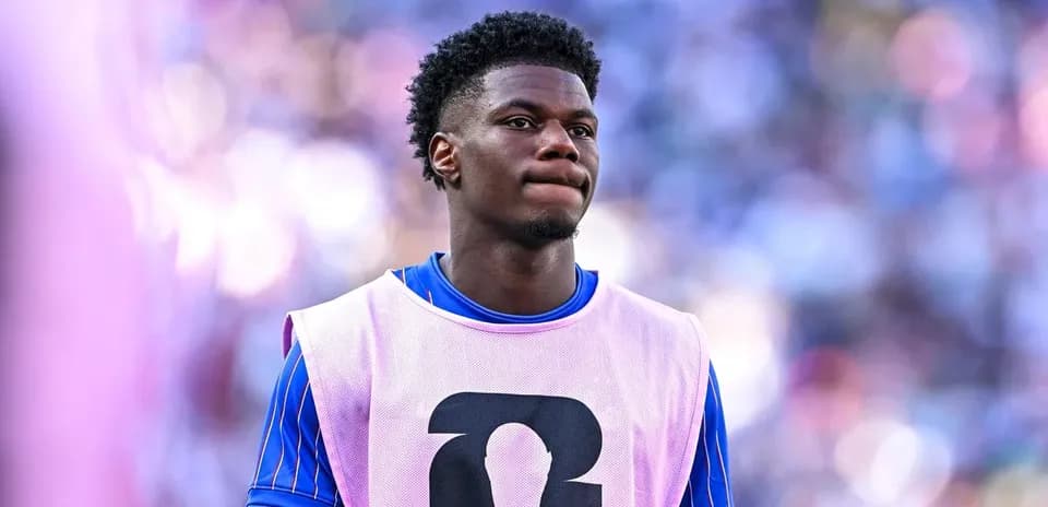 Player in training bib during match warm-up