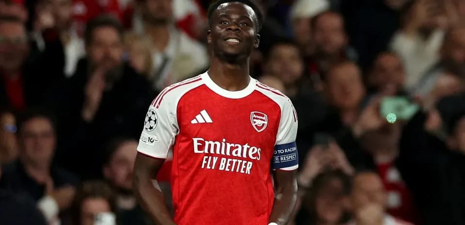 Player celebrating in Arsenal jersey during match