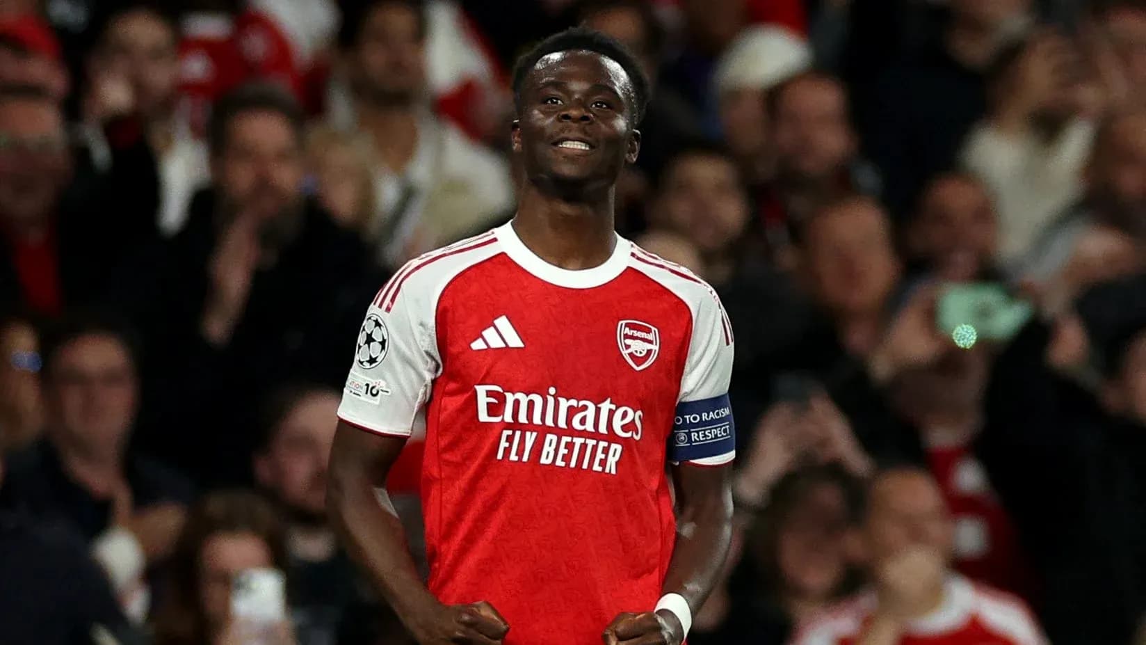 Player celebrating in Arsenal jersey during match