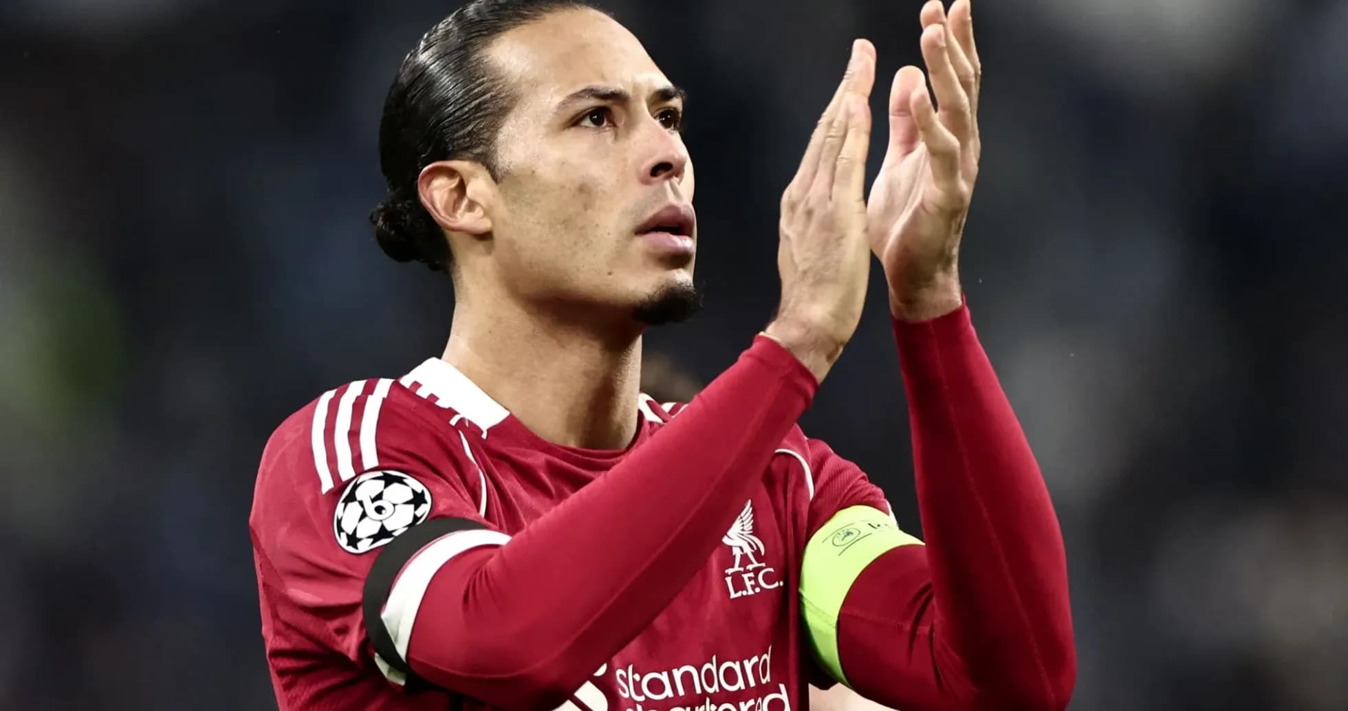 Player applauding fans during a match