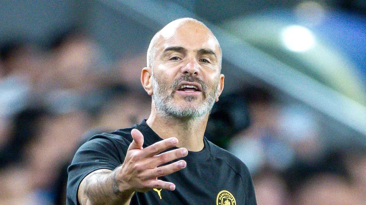 Coach gesturing during a match on the sidelines