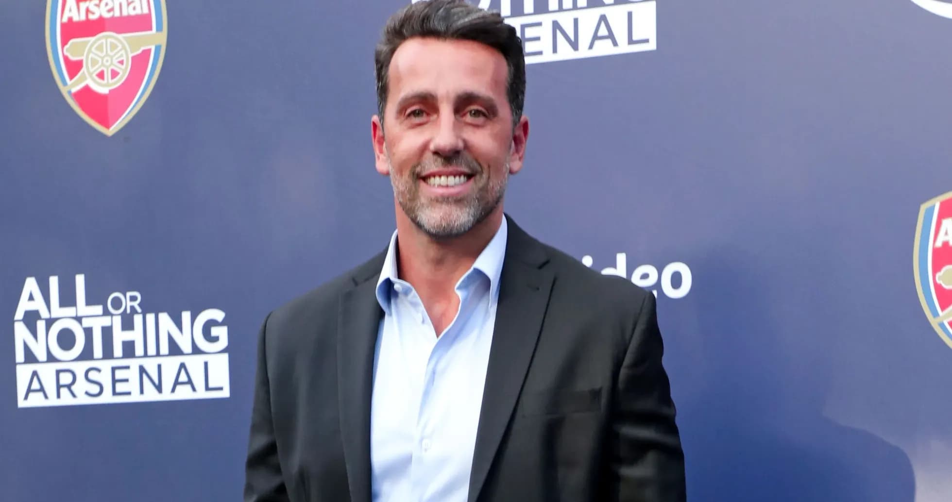 Man smiling at event promoting Arsenal documentary