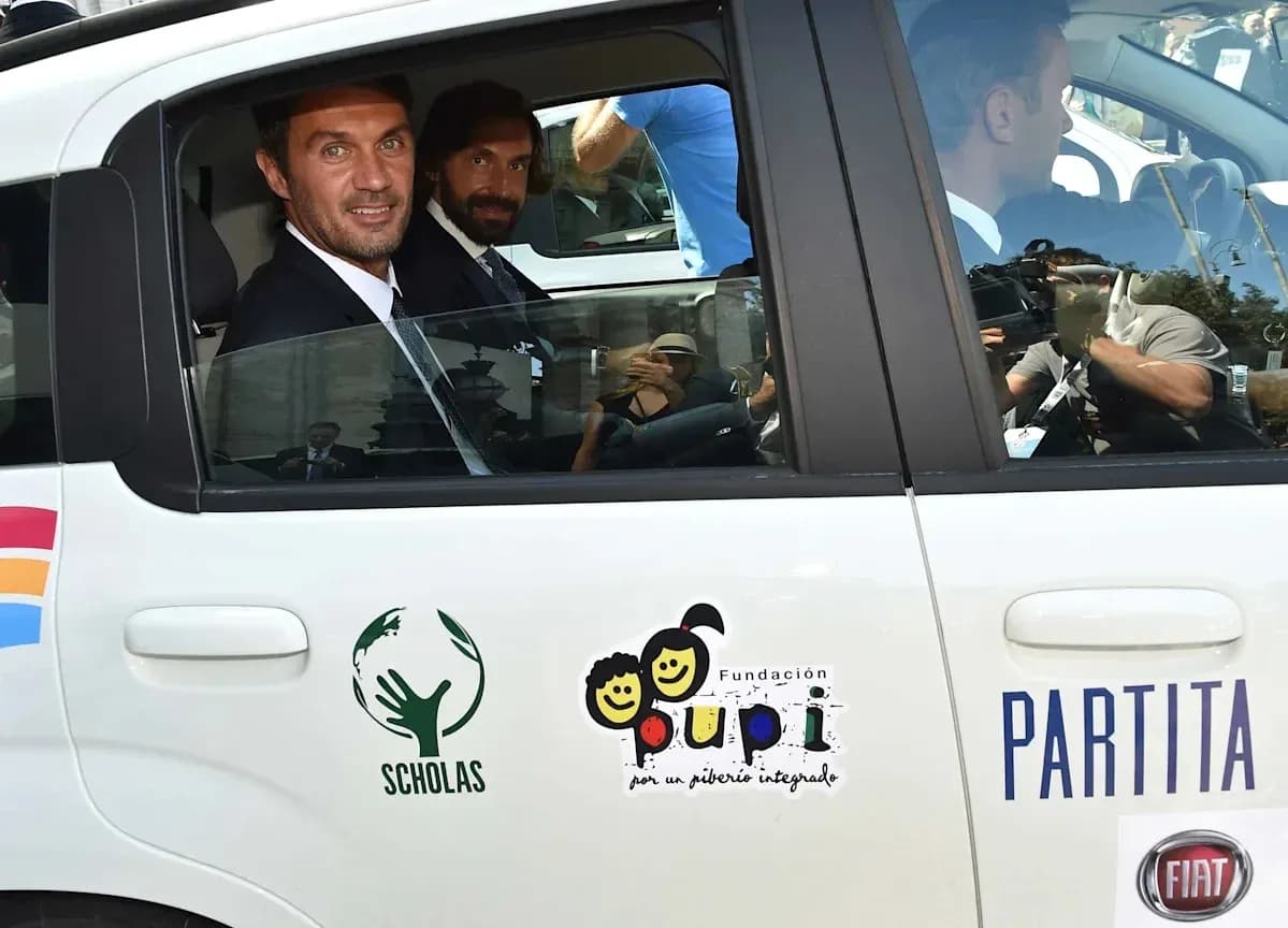 Two men in suits sitting in a car