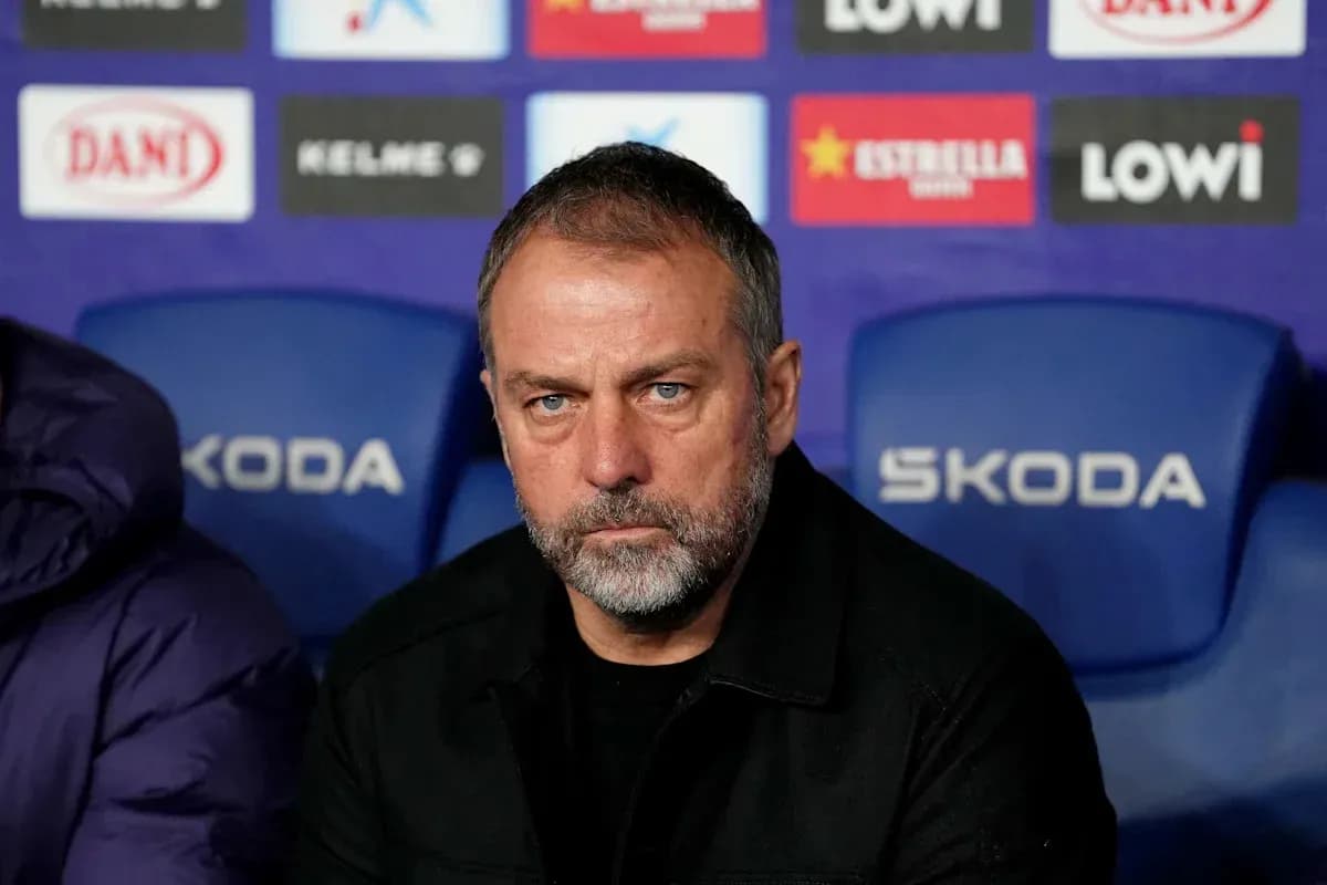 Manager seated on bench during match