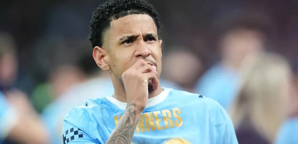 Player in blue jersey pondering during match