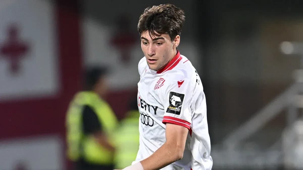 Player in white jersey during a football match