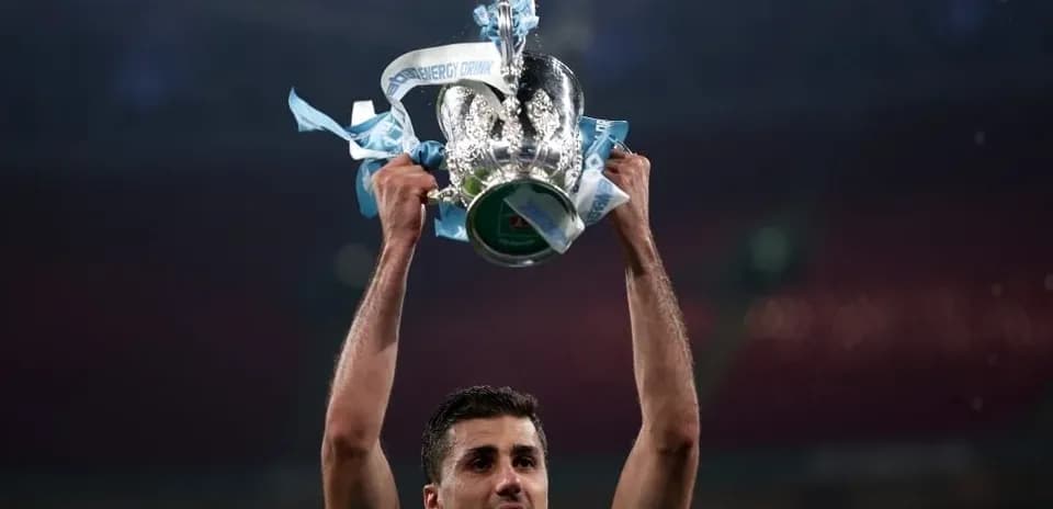 Player holding trophy aloft after victory