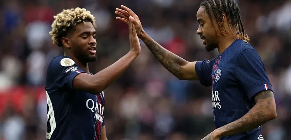Two Paris Saint-Germain players celebrating a goal